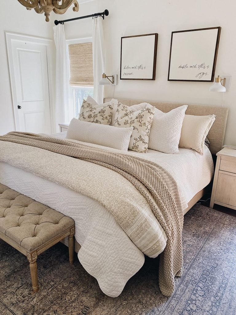 Luxurious bedroom with layered bedding and soft home textiles